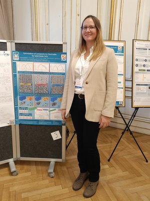 Barbara Buxbaum with her poster "Optimization of composite air electrodes for solid oxide cells". Photo Credits: M. Aksoy