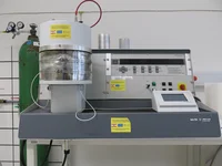 High vacuum coating device